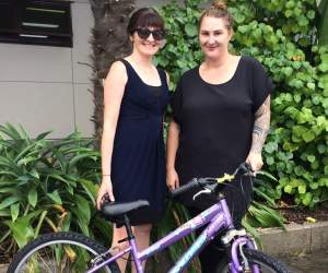  Catherine McCulloch from Sports BOP donates an old family bike to Candice Porter, Healthy Families East Cape Ōpōtiki.